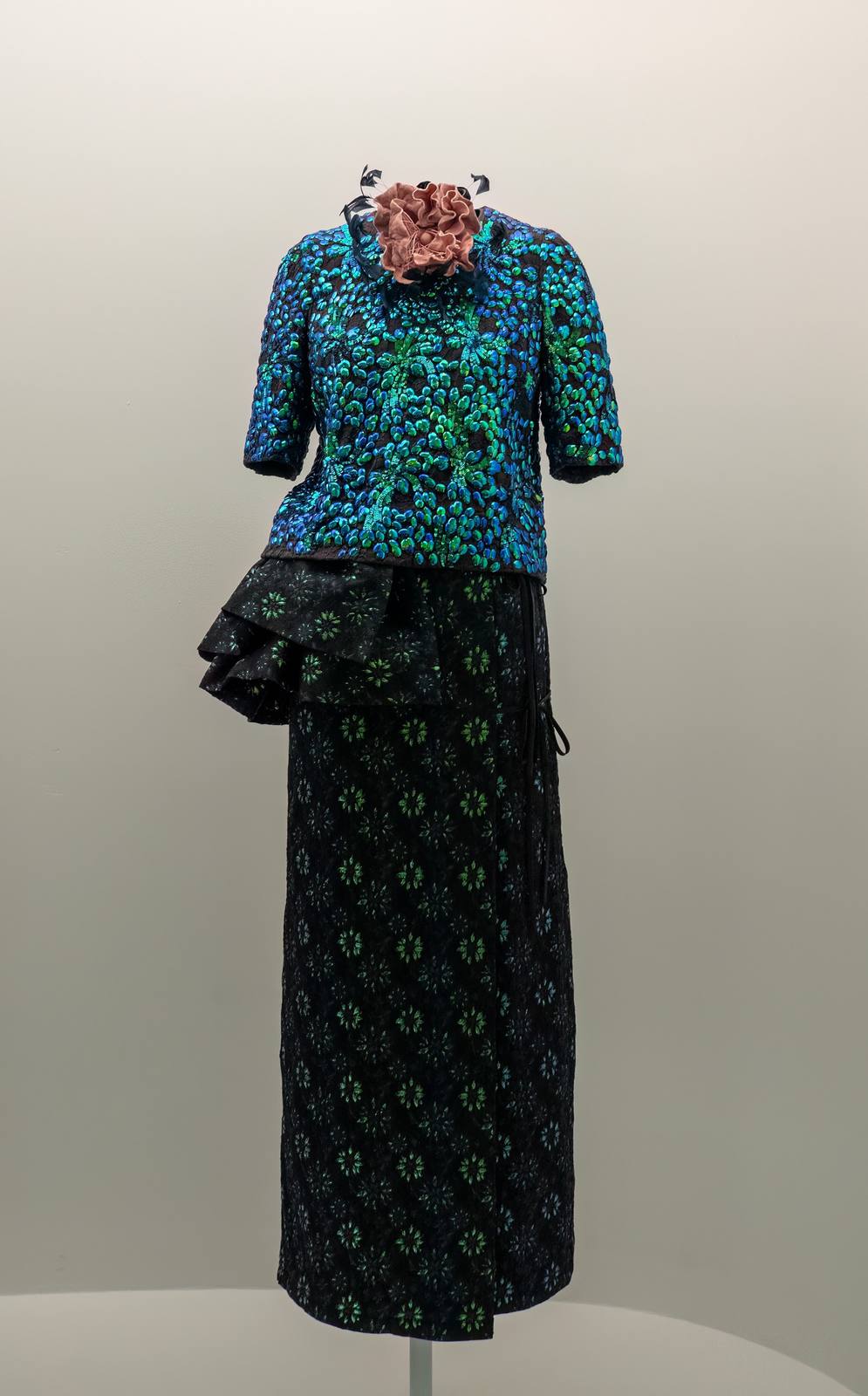 A Dries Van Noten ensemble of 2015-16 at the Metropolitan Museum of Art: an iridescent sequinned top and a long jacquard skirt.
