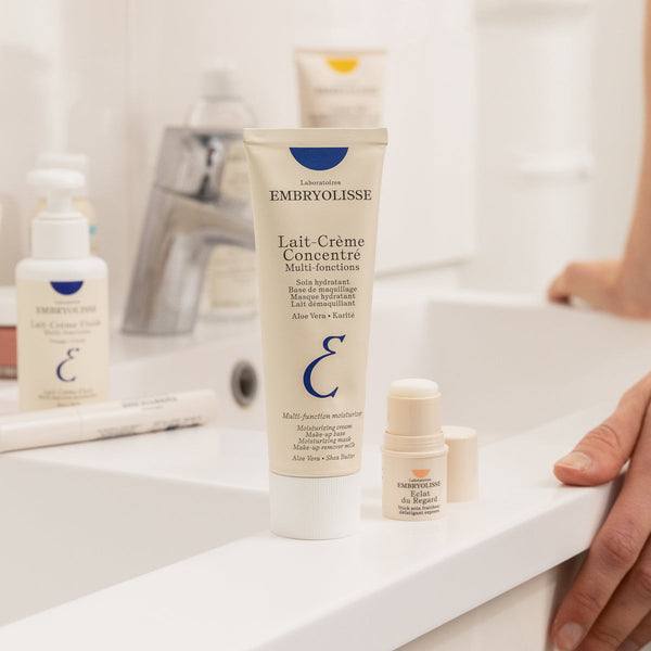 Embryolisse Lait-Creme Concentre with the range on a bathroom counter; official maker photograph